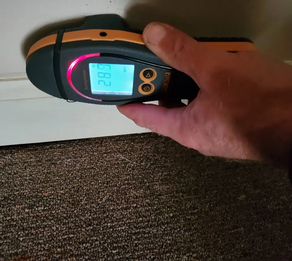 Moisture detection at baseboard during Storm Damage Restoration in Hempstead